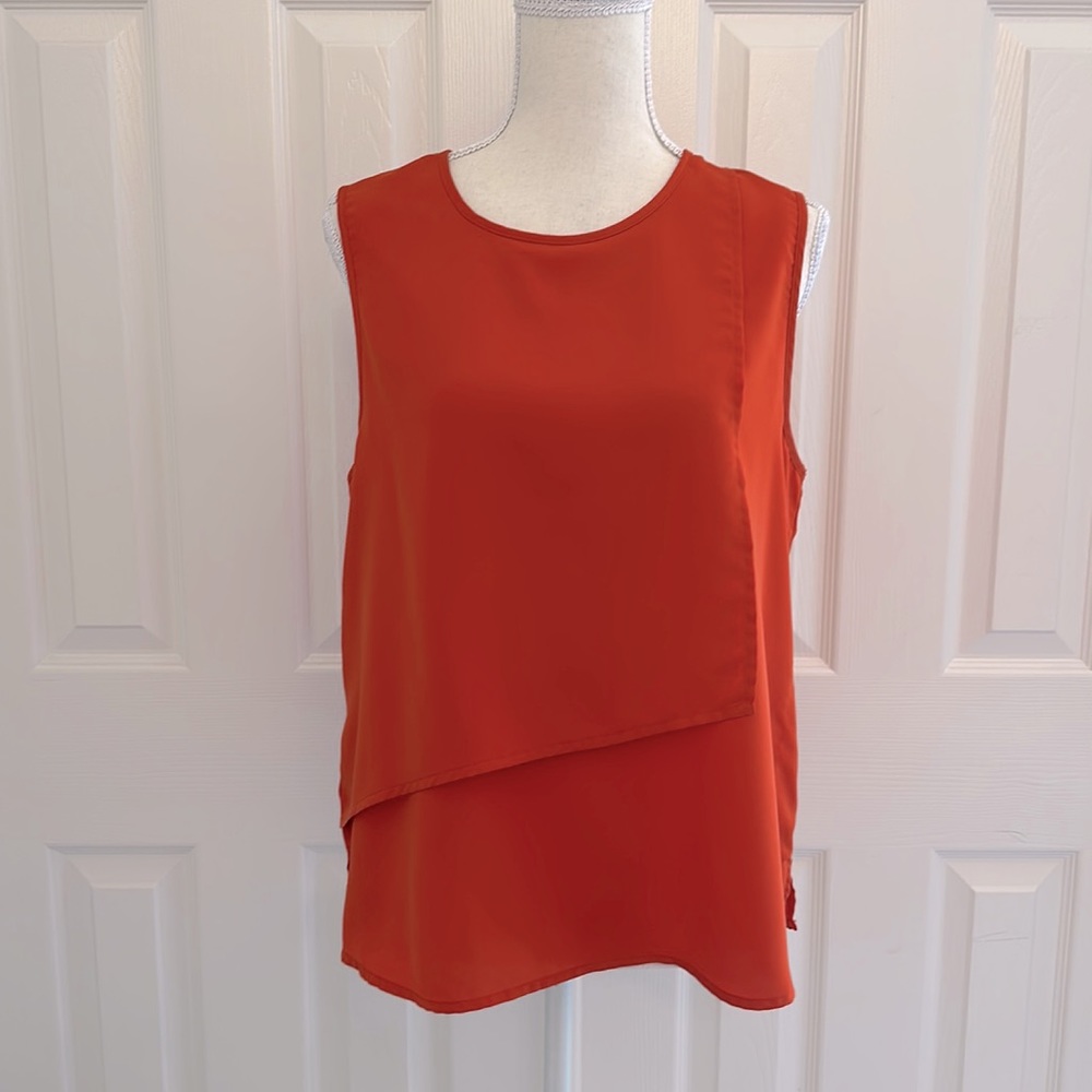 Burnt orange sleeveless blouse from BCBGMAXAZRIA. Size M. Worn 1x.